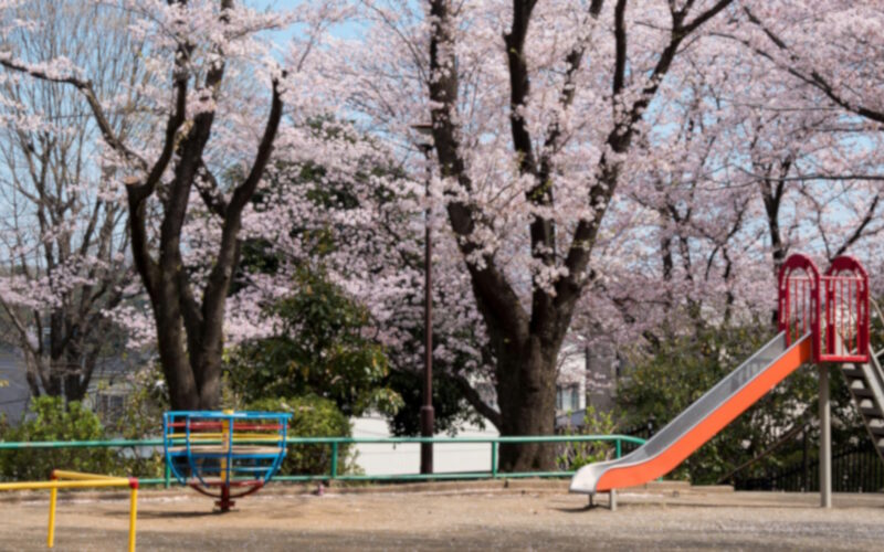 Empty playground in early spring, soft blur effect to reflect emotional tone of parenting blog post
